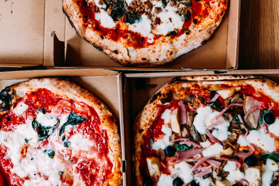 Three pizzas ready to eat