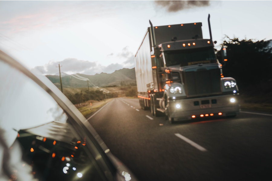 A truck driving at sunset