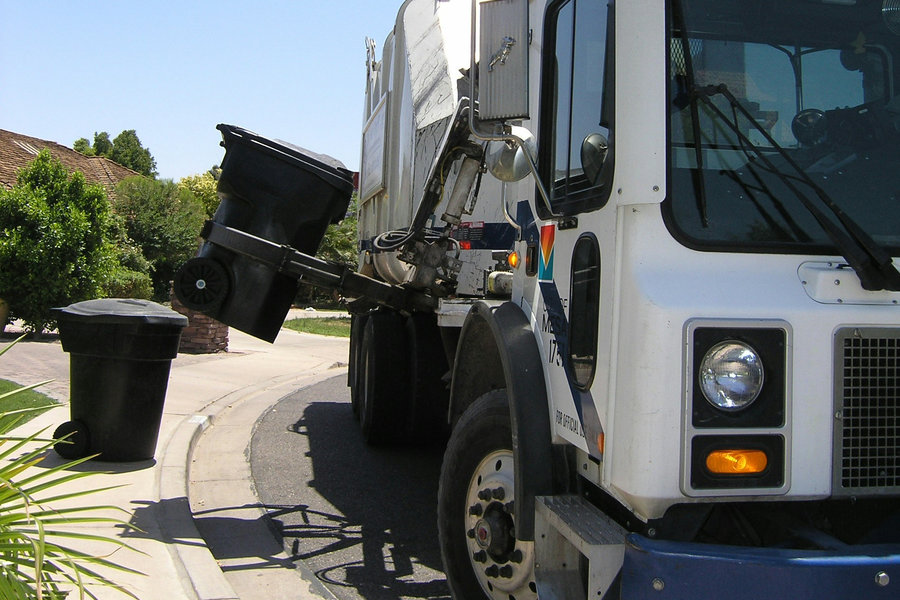 Rubbish truck picking up a bin